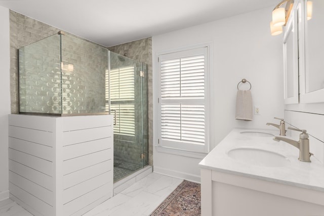 bathroom featuring an enclosed shower and vanity