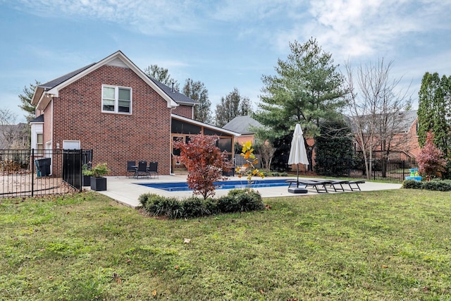 view of swimming pool with a patio and a yard