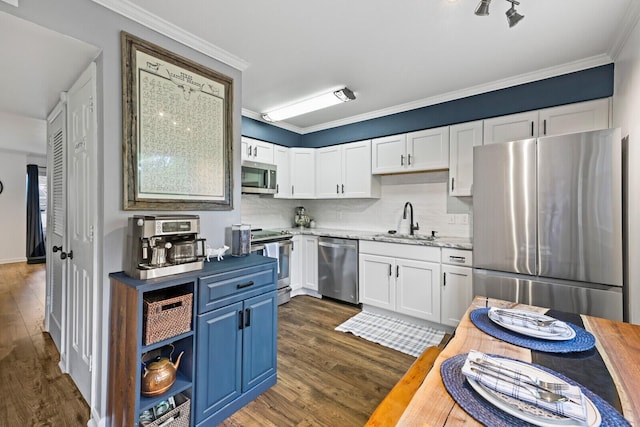 kitchen with sink, white cabinetry, stainless steel appliances, dark hardwood / wood-style flooring, and decorative backsplash