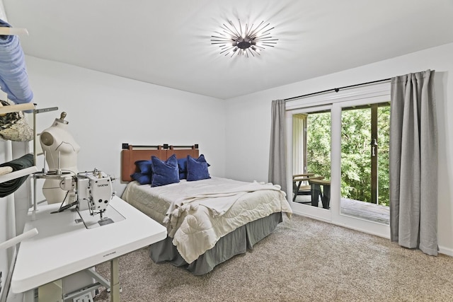 carpeted bedroom featuring access to outside