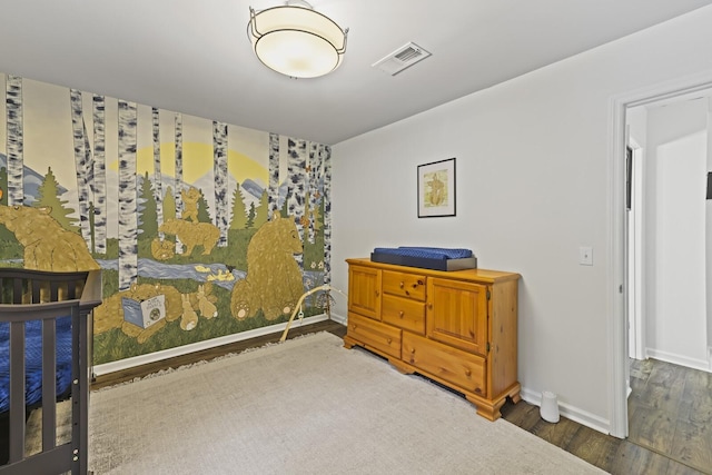 bedroom featuring dark hardwood / wood-style flooring