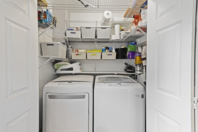 laundry area with independent washer and dryer