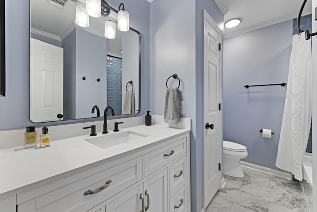 bathroom featuring vanity, ornamental molding, and toilet