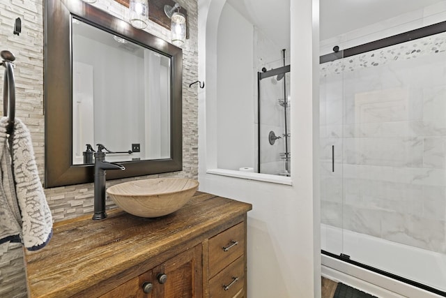 bathroom with an enclosed shower and vanity