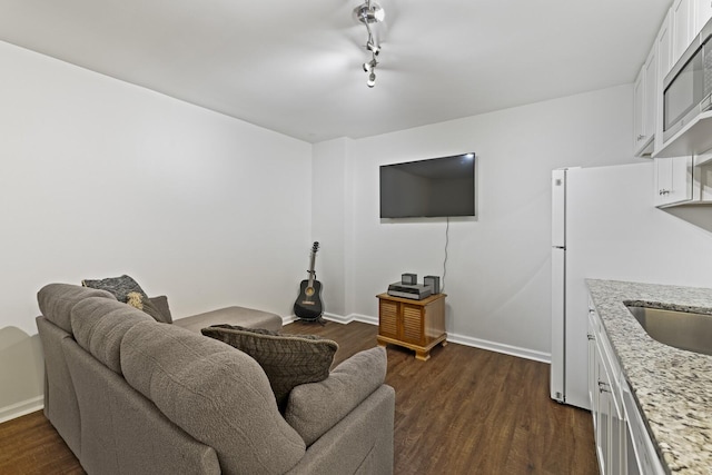 living room featuring dark hardwood / wood-style floors