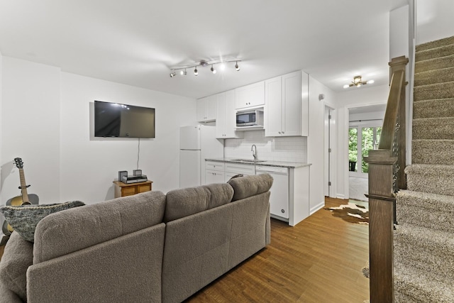 living room with sink and hardwood / wood-style floors