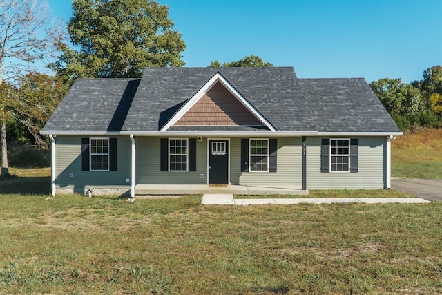 view of front of property featuring covered porch and a front yard