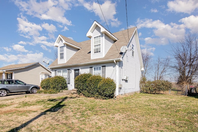 new england style home featuring a front yard