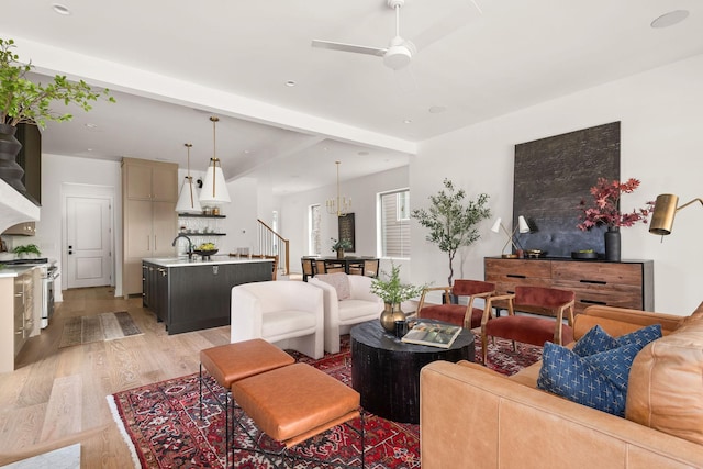 living room with stairs, recessed lighting, light wood-style floors, and ceiling fan