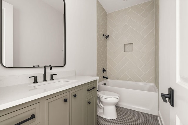 bathroom featuring vanity, tile patterned floors, toilet, and shower / washtub combination