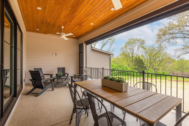 exterior space featuring ceiling fan and wooden ceiling