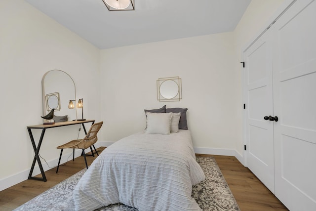 bedroom featuring a closet and light hardwood / wood-style flooring