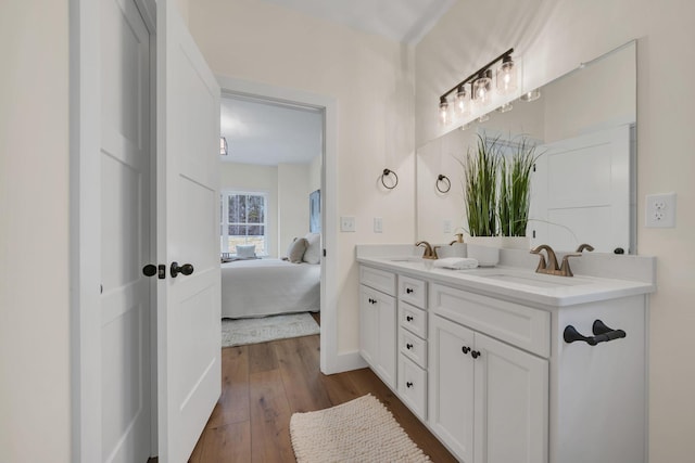 bathroom with vanity and hardwood / wood-style floors