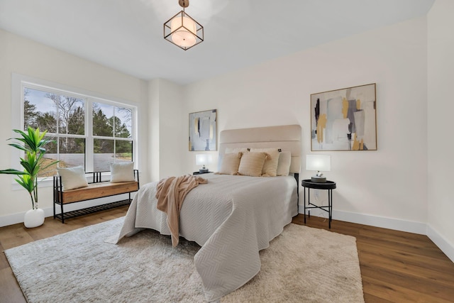 bedroom with wood-type flooring