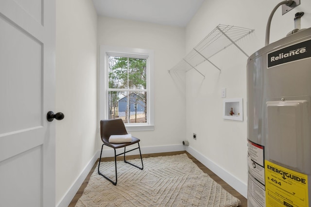 laundry room with electric dryer hookup, hookup for a washing machine, water heater, and hardwood / wood-style flooring