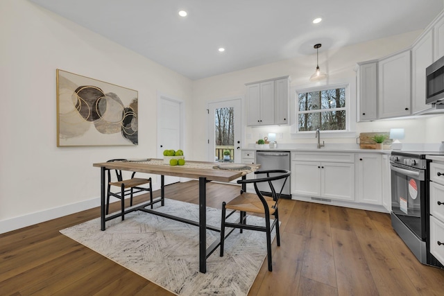 interior space with sink and dark hardwood / wood-style floors