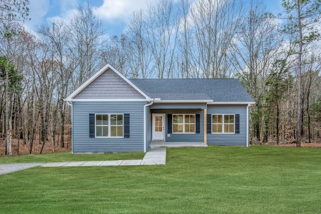 ranch-style home with covered porch and a front lawn