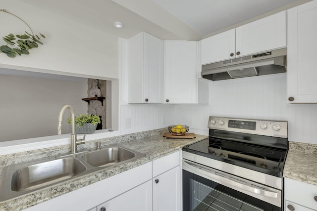 kitchen featuring sink, white cabinetry, and stainless steel range with electric cooktop