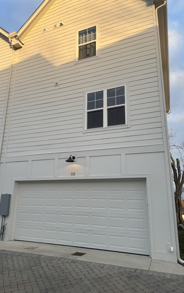 view of side of property featuring a garage