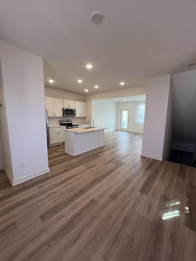 302 Williams Ave Unit 110, Madison, TN 37115 - kitchen with recessed lighting, white cabinets, appliances with stainless steel finishes, and open floor plan