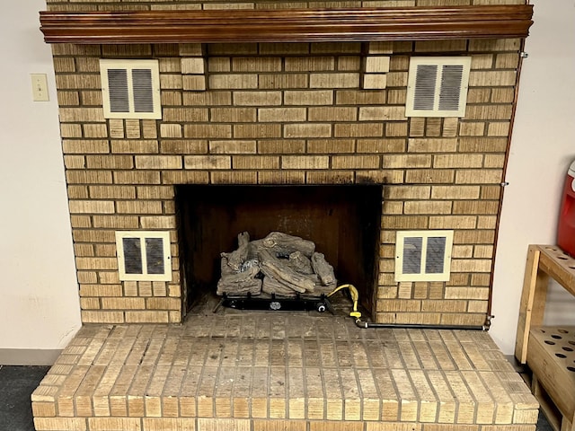 room details featuring a brick fireplace