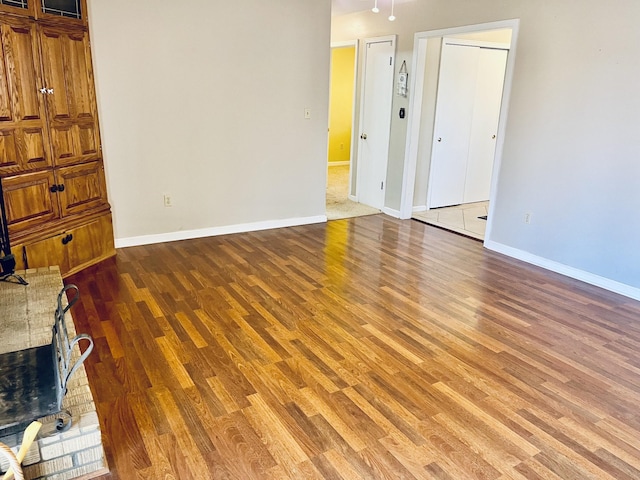 empty room with dark wood-type flooring