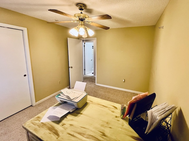 interior space featuring ceiling fan and a textured ceiling