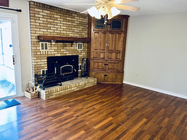 unfurnished living room featuring hardwood / wood-style flooring, ceiling fan, plenty of natural light, and a textured ceiling