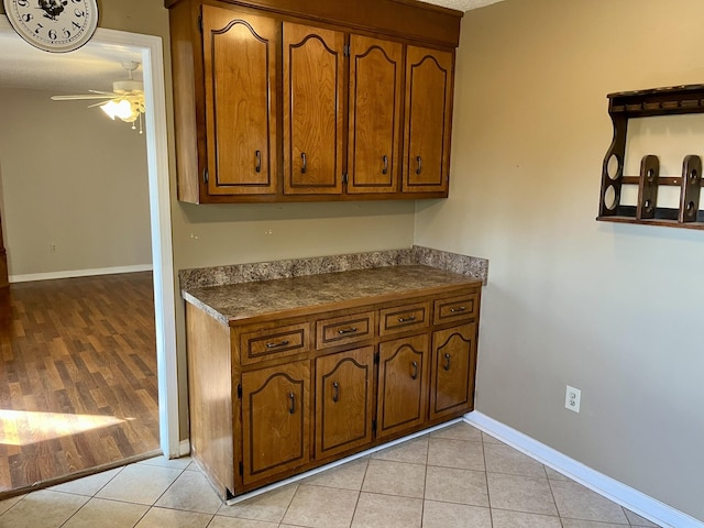 kitchen featuring ceiling fan and light tile patterned floors