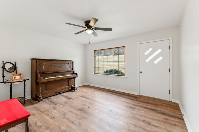 foyer entrance featuring ceiling fan and light hardwood / wood-style flooring