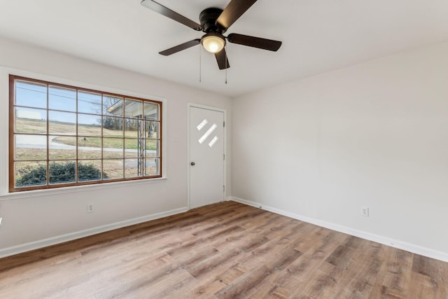 spare room with ceiling fan and light hardwood / wood-style flooring