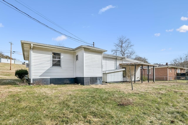 rear view of house with a lawn