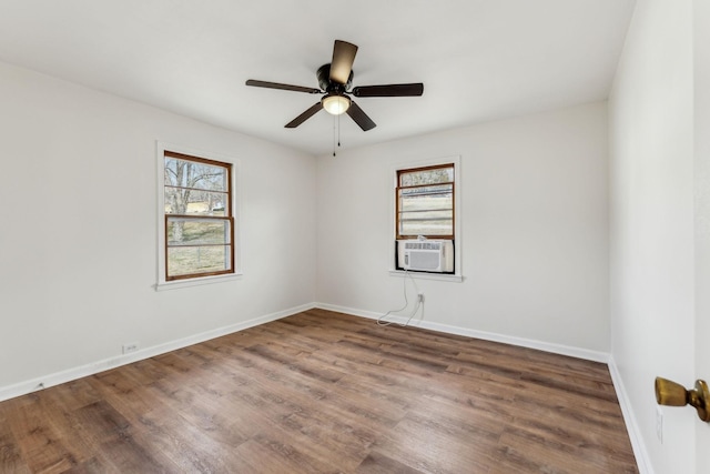 unfurnished room featuring ceiling fan, cooling unit, and dark hardwood / wood-style flooring