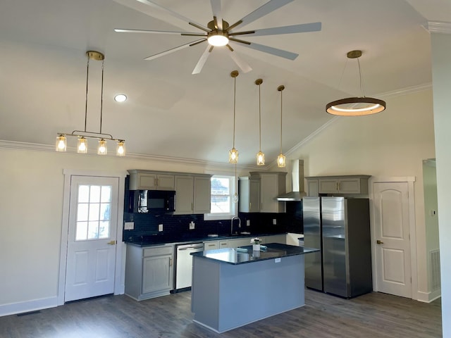 kitchen featuring pendant lighting, wall chimney exhaust hood, gray cabinets, a center island, and stainless steel appliances