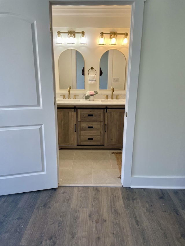 bathroom with hardwood / wood-style flooring and vanity