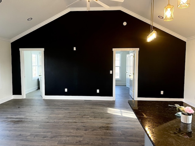 unfurnished room with crown molding, a healthy amount of sunlight, and lofted ceiling