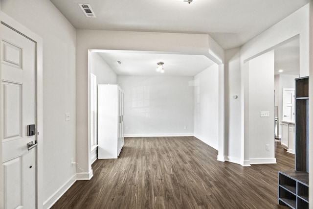 interior space with dark hardwood / wood-style floors