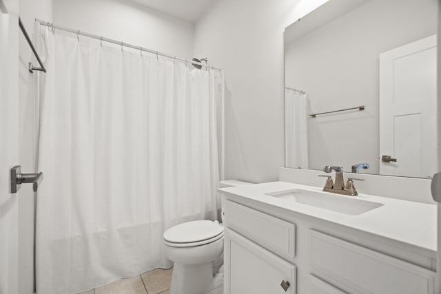 full bathroom featuring shower / bath combo, toilet, tile patterned floors, and vanity