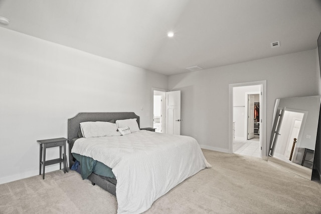 carpeted bedroom featuring a spacious closet