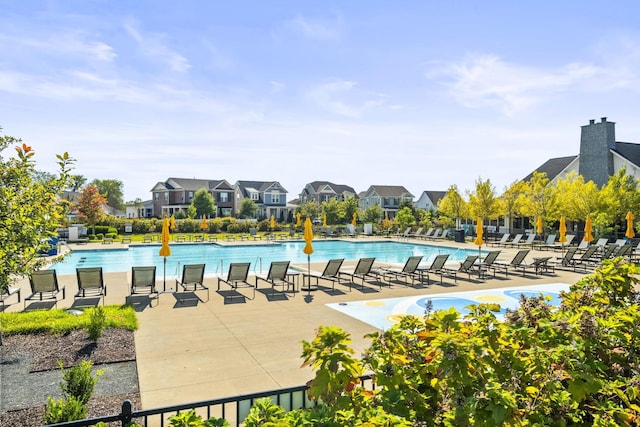 view of swimming pool with a patio area