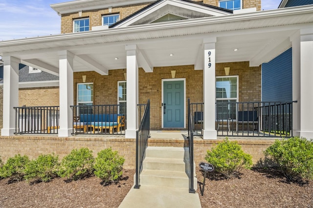 property entrance featuring covered porch