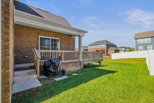 view of yard featuring a wooden deck