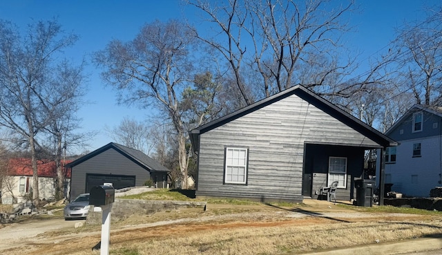 view of front of house with an outbuilding and a garage