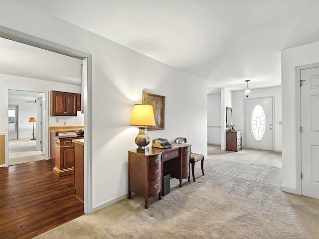 view of carpeted foyer entrance