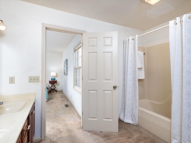 bathroom with vanity and shower / tub combo