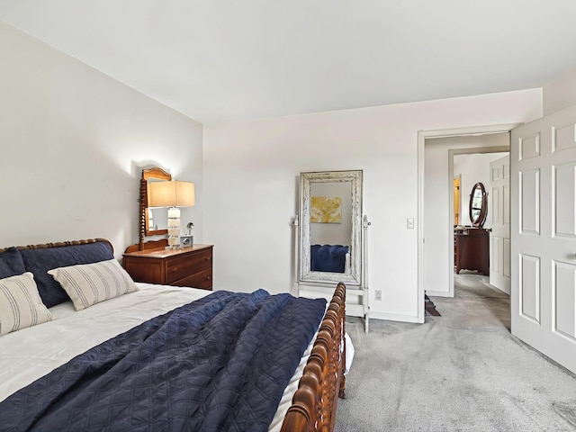 bedroom featuring light colored carpet