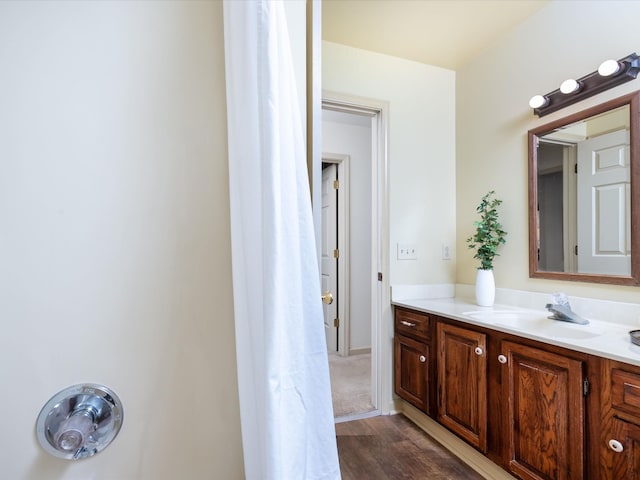 bathroom featuring vanity and hardwood / wood-style floors