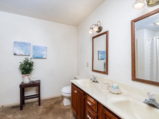 bathroom featuring toilet and vanity