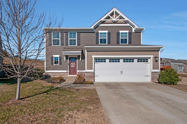 view of front of home with a garage and a front lawn