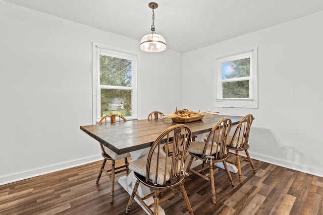 dining area featuring dark hardwood / wood-style floors